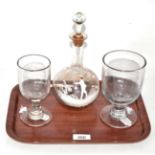 A Mary Gregory style bottle decanter and stopper and two goblets