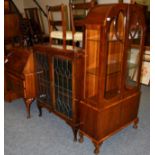 A 1920's mahogany vitrine cabinet, together with an oak leaf glazed bookcase of similar date and a