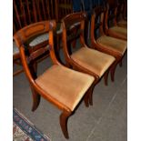 A set of six Regency carved mahogany dining chairs with two similar (8)