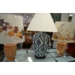 A Chinese style large ceramic table lamp; a pair of unglazed ceramic vase table lamps and three