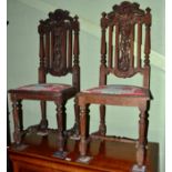 A pair of Period style carved hall chairs