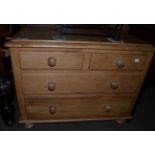 A pine chest of drawers