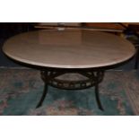 A Circular Pink Composition Marble Dining or Centre Table, raised on a wrought iron base with