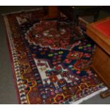 A Hamadan style rug, the central floral medallion surrounded by zoomorphic spandrels and