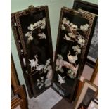 A set of four Japanese mother of pearl mounted lacquer panels