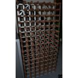 A metal framed and timber 105 bottle wine rack