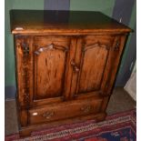 A Titchmarsh & Goodwin Oak Television Cabinet, model RL776/NC, two fielded cupboard doors with H