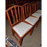 A set of four 20th century oak dining chairs