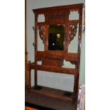 Late Victorian carved oak mirrored hall stand