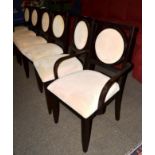 A set of six chairs of recent date, upholstered in beige velvet with padded back support and