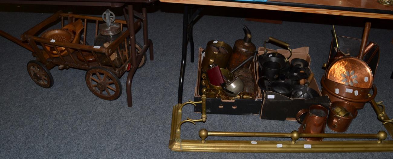 A group of 19th century and later copper iron wares, a dog cart, brass fender etc