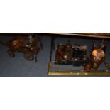 A group of 19th century and later copper iron wares, a dog cart, brass fender etc