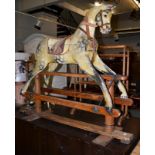 Painted wooden rocking horse on trestle base