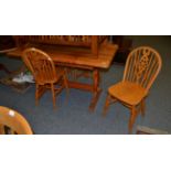 A refectory table and four pine chairs