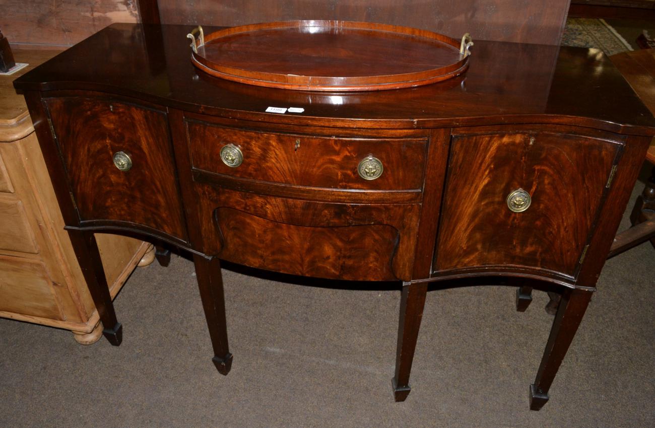A mahogany serpentine sideboard together with an Edwardian oval twin handled tray (2)