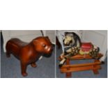 A Leeway carved wood rocking horse on trestle base and a leather dog stool (2)