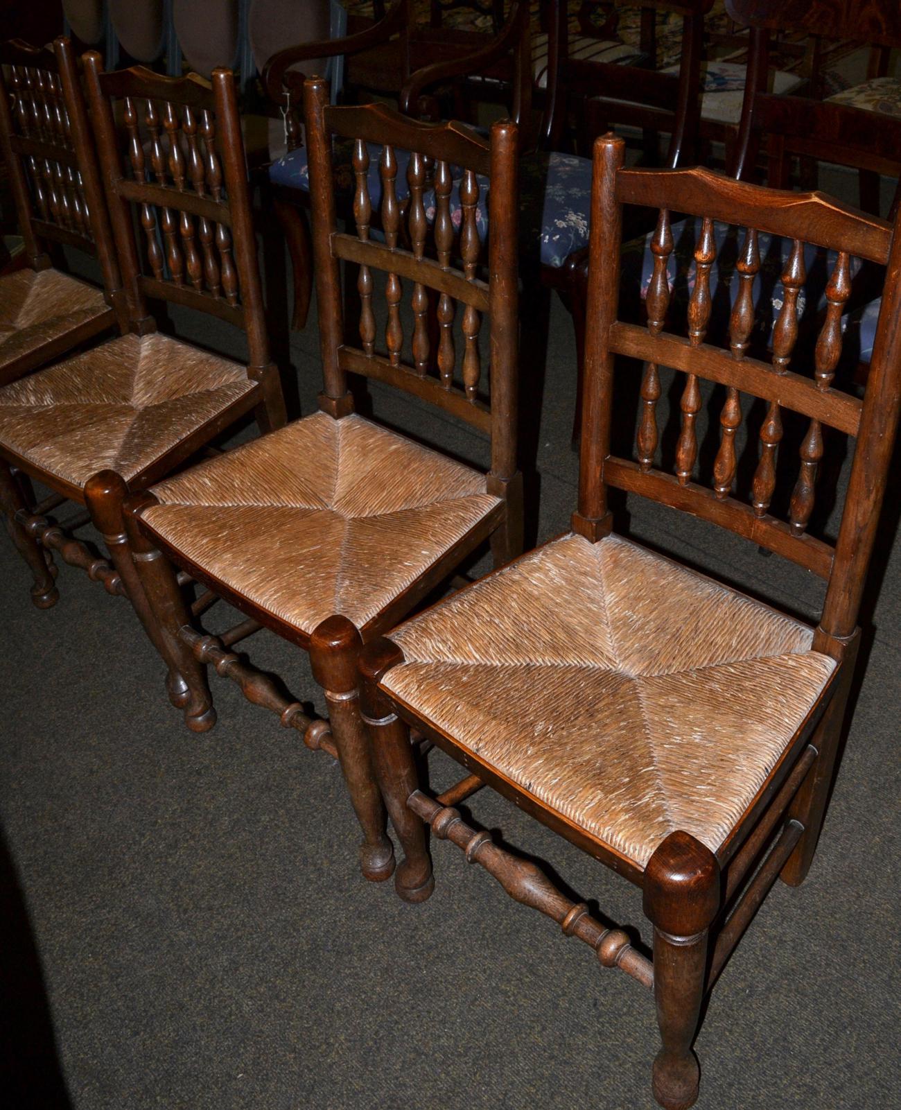 Set of four rush seated spindle back country chairs