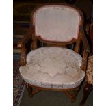 A 19th century carved mahogany open armchair with upholstered back and seat