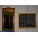 A rectangular wall mirror with rams head and a gilt framed panel with faceted drops
