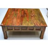 A Reproduction Hardwood Coffee Table of square form raised on chamfered legs, 111cm by 111cm by 45