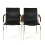 A Pair of Retro Chrome and Black Leather Armchairs, with curved tubular frames, 55cm by 45cm by