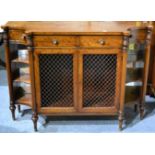 A Regency Style Credenza of recent date, with four frieze drawers above brass grille doors flanked