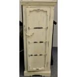 A Shabby Chic Cream Painted Cabinet, the cupboard door with metal straps and chain enclosing two