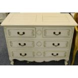 A Cream Painted Four Drawer Commode of recent date, two short over two long drawers, above a