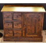 A Reproduction Hardwood Chest, six small drawers flanked by a cupboard raised on a plinth base, 87cm