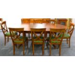 An Eleven Piece Reproduction Cherrywood Dining Suite, comprising oval extending dining table,