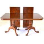 A Reproduction Burr Walnut Twin-Pedestal Extending Dining Table of recent date, with two removable