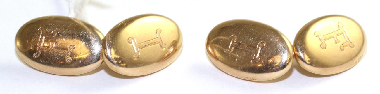 A pair of 15 carat gold double oval cufflinks, double bar linked, monogrammed The cufflinks are in