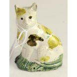 A Pratt type pottery model of a seated cat, circa 1800, with brown, green and yellow decoration, 8.