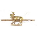 A stag bar brooch, the stag realistically modelled in a walking pose with an open mouth, to a