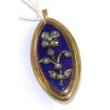 A diamond and blue enamel brooch/pendant, the oval pendant with a central floral motif set with rose