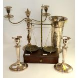 A pair of Old Sheffield plate candlesticks with oval bases, 28cm; a two branch silver plated