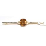 A citrine and split pearl bar brooch, an oval cut citrine in a yellow milgrain setting between
