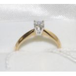An 18 carat gold diamond solitaire ring, a round brilliant cut diamond in a white four claw setting,