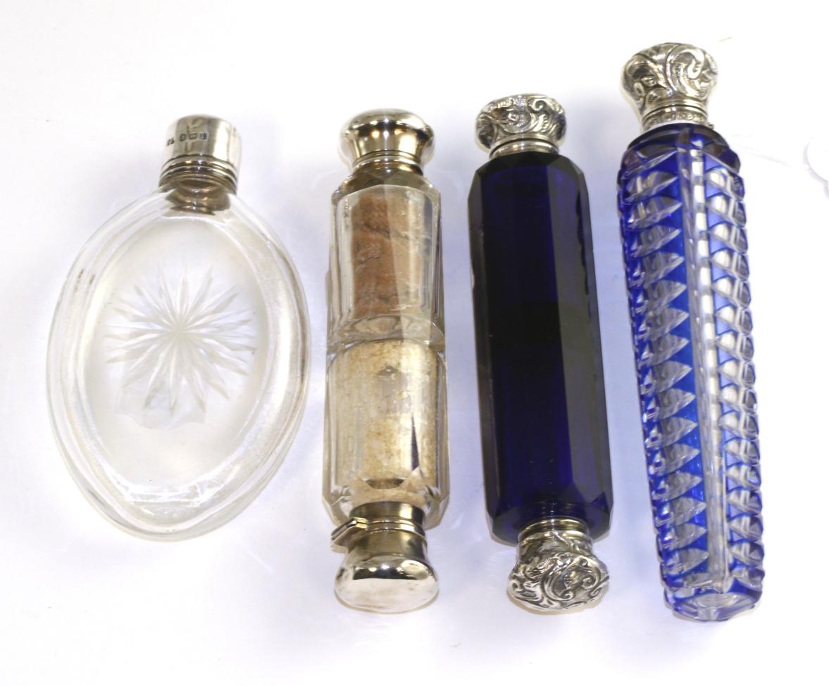 A George IV cut glass scent bottle with silver screw top, Birmingham, 1910, a blue flash glass scent