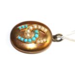 A turquoise and split pearl set oval locket pendant, the front applied with two interlocked horse