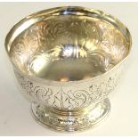 A George II silver sugar bowl, Edward feline, London 1742, the spherical body flat chased with