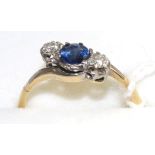 A sapphire and diamond three stone twist ring, a round cut sapphire between two old cut diamonds