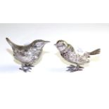 A pair of silver pepperettes stamped '800' as songbirds, 5cm high