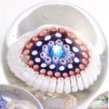 A millefiore domed glass paperweight, possibly Richardson, made up of concentric rings of blue,