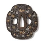 A Japanese gold and silver inlaid iron tsuba, 19th century, of quatrefoil form decorated with