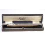 A 9 carat gold propelling pencil, with engine turned decoration, in a Farttorini & Sons Ltd