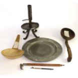 A pewter plate, a rush light holder, a horn milk skimmer, a carved spoon and a small parasol handle