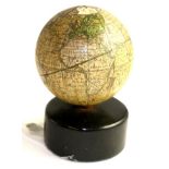 A 19th century new globe of the earth, raised on an ebonised stand, 11cm high