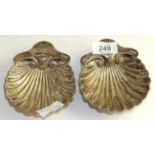 A matched pair of late Victorian silver butter shells, London 1895 and 1900, 13cm long 4.4ozt