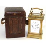 A brass striking and repeating carriage clock, retailed by Goldsmiths & Silversmiths Company,